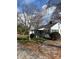 Charming single-story home featuring decorative wagon wheels and well-maintained landscaping at 949 Grace Ave, Lancaster, SC 29720