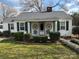 Charming single-story home featuring decorative wagon wheels and well-maintained landscaping at 949 Grace Ave, Lancaster, SC 29720