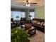 Relaxing living room featuring a large leather sofa set, with bright natural light at 949 Grace Ave, Lancaster, SC 29720