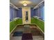 Unique room with ample storage racks, colorful patchwork carpet and bright blue walls at 949 Grace Ave, Lancaster, SC 29720