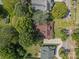 An aerial view of a well maintained home with a brown roof and driveway at 405 7Th St, Spencer, NC 28159