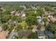 A beautiful aerial view of a home and community with lush trees and greenery at 405 7Th St, Spencer, NC 28159