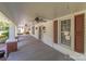 Relaxing front porch with ceiling fans and exterior shutters at 405 7Th St, Spencer, NC 28159