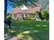 Charming home with a well-manicured front lawn, mailbox and inviting entrance at 405 7Th St, Spencer, NC 28159