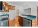 Well-lit kitchen with tile backsplash and stainless steel sink, with a cozy design at 405 7Th St, Spencer, NC 28159