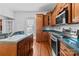Kitchen with stainless steel appliances, tile backsplash and plenty of counterspace and cabinets at 405 7Th St, Spencer, NC 28159