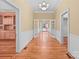 Spacious living room featuring gleaming hardwood floors and French doors leading to the outdoors at 405 7Th St, Spencer, NC 28159