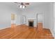 Inviting living room featuring wood floors and a decorative fireplace at 405 7Th St, Spencer, NC 28159
