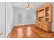 Spacious living room features wood floors, bright windows, and built in custom cabinet at 405 7Th St, Spencer, NC 28159
