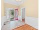 Mud room with tile flooring and a red door leading outside at 405 7Th St, Spencer, NC 28159