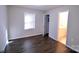 Bedroom with dark hardwood floors and access to bathroom at 602 Glenn St, Gastonia, NC 28052