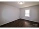 Simple bedroom with dark hardwood floors and a window at 602 Glenn St, Gastonia, NC 28052