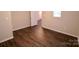 Bedroom with dark brown wood floors and white door at 602 Glenn St, Gastonia, NC 28052