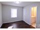 Spacious bedroom with dark hardwood floors and an ensuite bathroom at 602 Glenn St, Gastonia, NC 28052