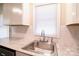 Kitchen sink and granite countertop with white cabinets at 602 Glenn St, Gastonia, NC 28052