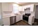 Kitchen with white cabinets, stainless steel appliances, and granite countertops at 602 Glenn St, Gastonia, NC 28052