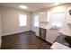 Kitchen with white cabinets, stainless steel appliances, and granite countertops at 602 Glenn St, Gastonia, NC 28052