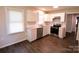 Kitchen with white cabinets, stainless steel appliances, and granite countertops at 602 Glenn St, Gastonia, NC 28052