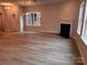 Bright living room with fireplace, hardwood floors and natural light from several windows at 4069 Port Richmond Ave # 16, Gastonia, NC 28056