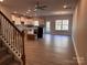 View from staircase, kitchen has white cabinets and stainless appliances and wood-look floors at 4081 Port Richmond Ave # 19, Gastonia, NC 28056