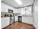 Modern kitchen with white cabinets, stainless steel appliances at 410 Gaddy St, Kannapolis, NC 28081