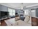 Cozy living room featuring fireplace and ample natural light at 410 Gaddy St, Kannapolis, NC 28081