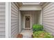 Covered entryway showcasing a welcoming front door with a wreath and well-maintained landscaping at 984 Kirby Dr, Fort Mill, SC 29715