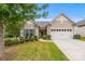 Tan two-story house with attached garage and landscaped yard at 984 Kirby Dr, Fort Mill, SC 29715