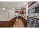 Modern kitchen with stainless steel appliances, granite countertops and a large center island with barstool seating at 984 Kirby Dr, Fort Mill, SC 29715