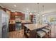 Modern kitchen with stainless steel appliances, granite countertops and a large center island with barstool seating at 984 Kirby Dr, Fort Mill, SC 29715