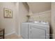 Laundry room with washer, dryer, and overhead shelving at 984 Kirby Dr, Fort Mill, SC 29715