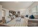 Bright living room with a fireplace, hardwood floors, and view of the kitchen and dining area at 984 Kirby Dr, Fort Mill, SC 29715