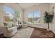 Sunlit sitting area with two armchairs and large windows at 984 Kirby Dr, Fort Mill, SC 29715