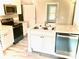 Renovated kitchen featuring modern appliances and white cabinetry at 1012 4Th St, Statesville, NC 28677