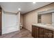 Bathroom featuring a shower/tub combo, a granite-look sink with wooden cabinets at 1128 Bethesda Rd, Statesville, NC 28677