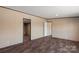 Bedroom featuring updated flooring and neutral walls with entrances to other rooms at 1128 Bethesda Rd, Statesville, NC 28677