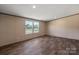 Bright bedroom with updated flooring and double windows providing natural light at 1128 Bethesda Rd, Statesville, NC 28677