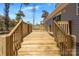 Staircase leading onto a wood deck with a view of the yard at 1128 Bethesda Rd, Statesville, NC 28677