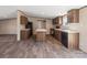 Modern kitchen with a center island, dark wood cabinetry, and stainless steel appliances for a stylish look at 1128 Bethesda Rd, Statesville, NC 28677