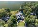 Aerial view of estate with large home, pool, circular driveway, and lake access at 1873 Farrow Dr, Rock Hill, SC 29732