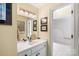 Bathroom vanity with a sink, mirror, and updated fixtures, and a view to the shower at 1873 Farrow Dr, Rock Hill, SC 29732
