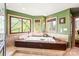 Bathroom featuring a large bathtub, tiled floors, and windows with natural light at 1873 Farrow Dr, Rock Hill, SC 29732