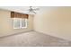 Bedroom featuring neutral colored walls, carpet, and a window with natural light at 1873 Farrow Dr, Rock Hill, SC 29732