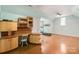 Light-filled bonus room features custom built-ins, hardwood floors, a treadmill, and neutral paint at 1873 Farrow Dr, Rock Hill, SC 29732