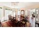 Elegant dining room with a large wooden table, ornate ceiling, and access to additional rooms at 1873 Farrow Dr, Rock Hill, SC 29732