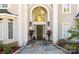 Elegant front entrance with stone steps, potted flowers, and arched doorway at 1873 Farrow Dr, Rock Hill, SC 29732