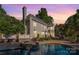 Exterior view of the home showing the in-ground pool, hottub, patio and beautiful backyard at 1873 Farrow Dr, Rock Hill, SC 29732