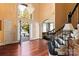 Bright foyer showcasing hardwood floors, staircase, and chandelier visible through arched window at 1873 Farrow Dr, Rock Hill, SC 29732