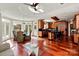 Open concept living area featuring a modern kitchen, dining area, and bright sunroom with large windows at 1873 Farrow Dr, Rock Hill, SC 29732