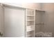 Walk-in closet with wood shelves and hanging rods at 3778 Rock Bridge Ne Dr, Conover, NC 28613